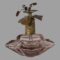 Main photo of vintage Irice scent bottle seen from an eye level with the wide side in the foreground. The filigree gilt metal neck of the lid is clearly visible and the structuring of the gilt metal leaves and stalks holding the purple rhinestones although the rhinestones themselves are not very visible here. The inner tube which attaches to the pump is absent but should be easy to replace. Even if not used for scent, this is a beautiful glass objet d'art!