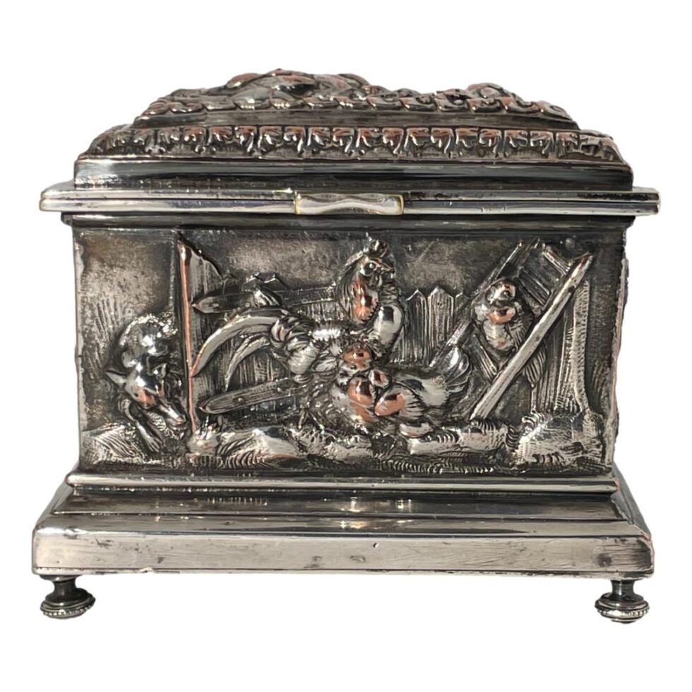 Now back full circle to show the whole front panel of the French repousse jewellery casket from an eye level. The fox eyeing up the hens is fully visible as is the heavily embossed shape of the lid which we will get to in a little while.