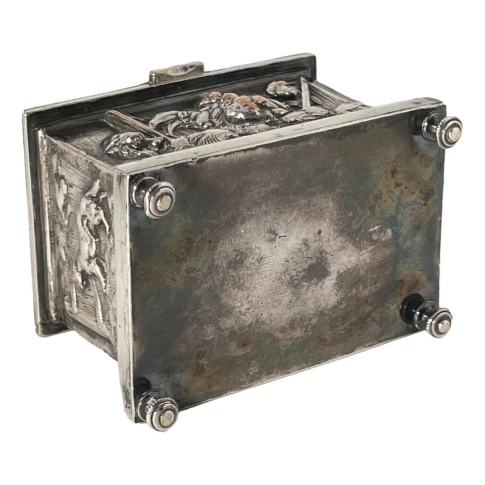 Photo of the base of the jewellery casket showing all 4 feet. No markings on the base.