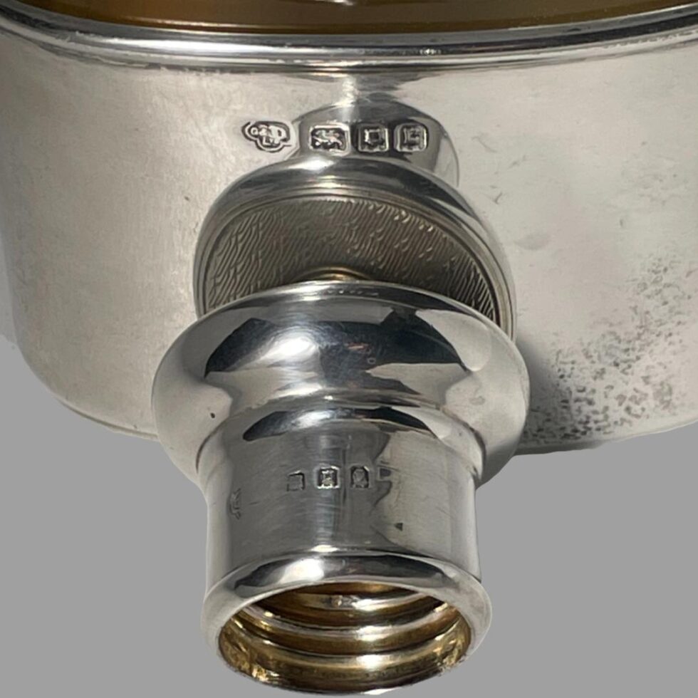 Close up photo of the 2 hallmarks of c1918 silver hip flask.