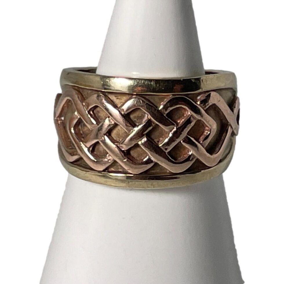 Photo of ring displayed on a cone shaped display stand with the ring front forward facing.