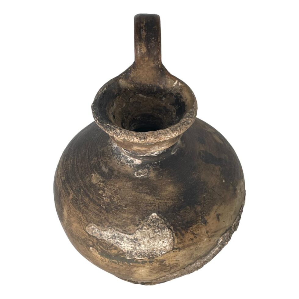 Photo of wine jug this time with the handle at the centre back. The angle of the shot is slightly raised and we are looking diagonally downward.