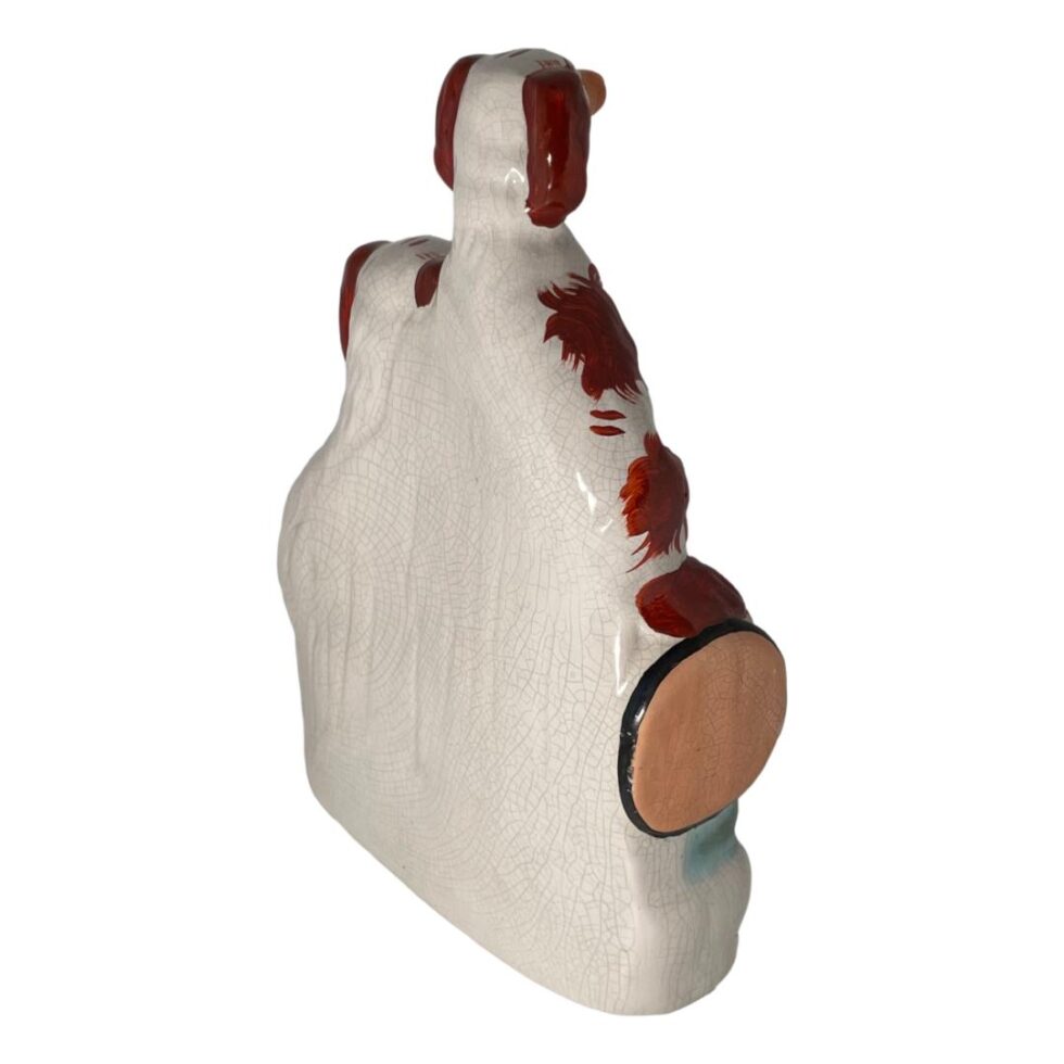 Photo of the back of the Staffordshire russet spaniels showing plain white. These pieces were made for the mantlepiece to sit against the wall so undecorated at the back.