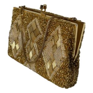 Main photo of vintage gold beaded bag seen from an eye level displayed diagonally with the sides in the top left and bottom right corners. One flat side of the bag is facing to the bottom left. This heavily beaded bag has a base of small gold beads and a design on both sides of diamond shaped panels at either end and joined double diamond at the centre. These panels have gold tubes and shimmering small white beads. The gilt metal chain is a round box chain and good thickness. Finished with a gilt metal frame and clasp. The bag is shown ajar.