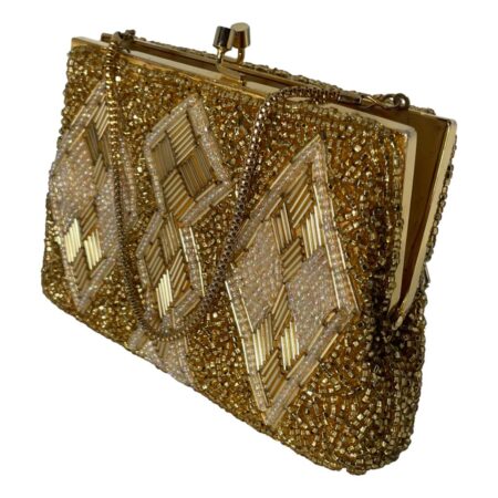 Main photo of vintage gold beaded bag seen from an eye level displayed diagonally with the sides in the top left and bottom right corners. One flat side of the bag is facing to the bottom left. This heavily beaded bag has a base of small gold beads and a design on both sides of diamond shaped panels at either end and joined double diamond at the centre. These panels have gold tubes and shimmering small white beads. The gilt metal chain is a round box chain and good thickness. Finished with a gilt metal frame and clasp. The bag is shown ajar.