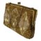 Main photo of vintage gold beaded bag seen from an eye level displayed diagonally with the sides in the top left and bottom right corners. One flat side of the bag is facing to the bottom left. This heavily beaded bag has a base of small gold beads and a design on both sides of diamond shaped panels at either end and joined double diamond at the centre. These panels have gold tubes and shimmering small white beads. The gilt metal chain is a round box chain and good thickness. Finished with a gilt metal frame and clasp. The bag is shown ajar.