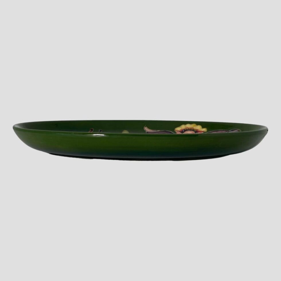 Photo of Moorcroft Columbine dish seen from an eye level. The dish has a little raised lip so from an eye level you can barely see the decoration.