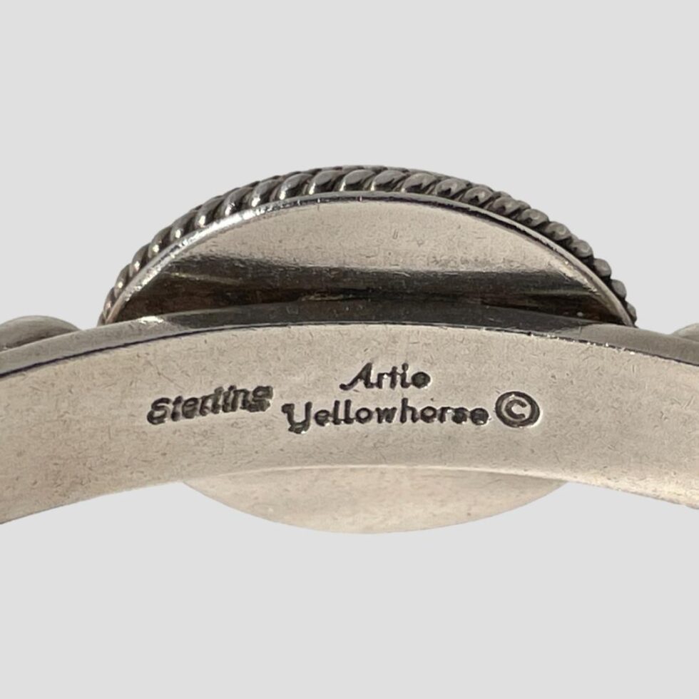 A close up photo of the artists signature and hallmark with copyright mark.