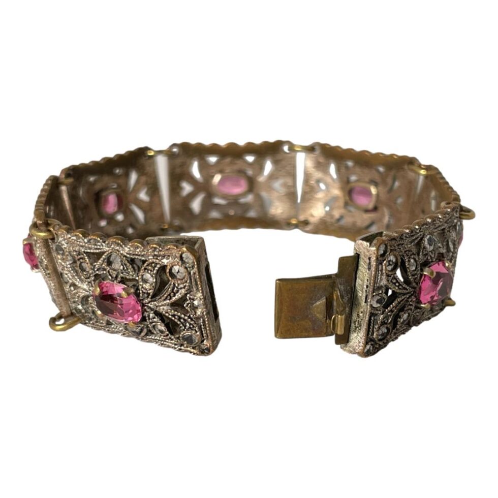 Photo of Czech Deco bracelet still displayed on a flat surface with the clasp area in the foreground and shown open.