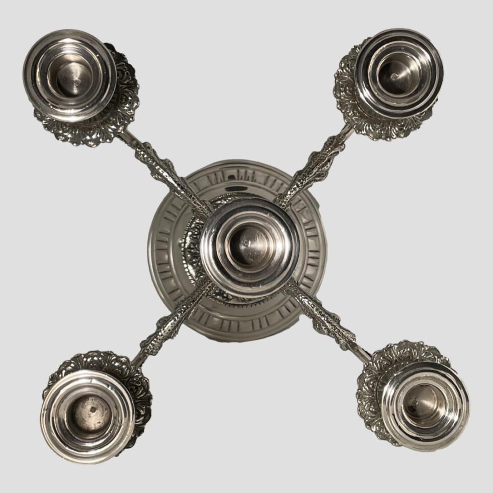 Photo looking straight down into the sconces from above The hallmark is just visible inside each one.