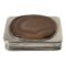 Main photo of antique silver table snuffbox seen from a raised angle looking diagonally down to the agate on the lid with parts of the surrounding silver visible all around. The box is very tactile with a smooth base and lid with rounded corners. The agate is set a little raised at the top with a silver frame surrounding it. The agate is a lovely natural colour bands in cream, pale browns and orange. The middle section of the box in slimmer than the lid and base giving a good grip to open the box lid.