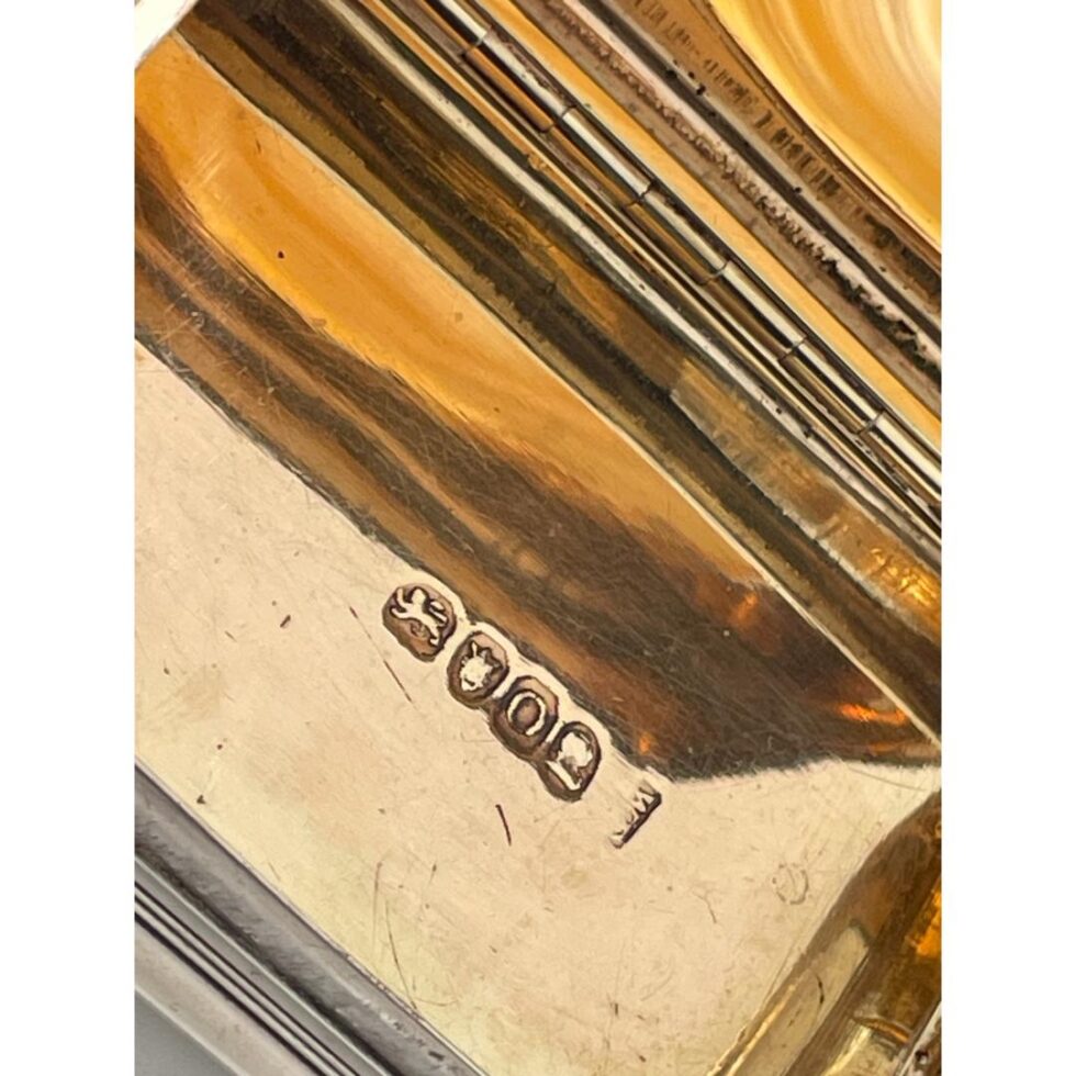 Close up photo of the full hallmark on the gilt base interior of the table snuffbox.