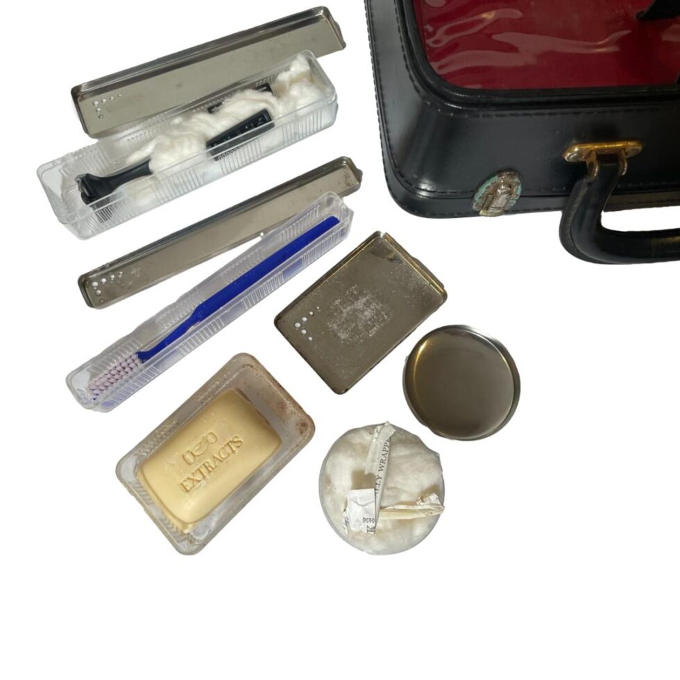 Close up photo of the individually cased items shown with lids removed. Shaver at top then toothbrush case followed by soap dish and finally the cotton wool pot.