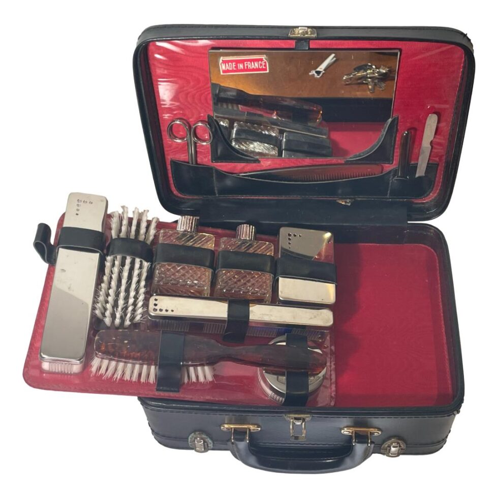 Photo of all thew contents inside their fitted compartments and with the tray lifted off and balanced on the left hand side revealing the shallow compartment beneath.