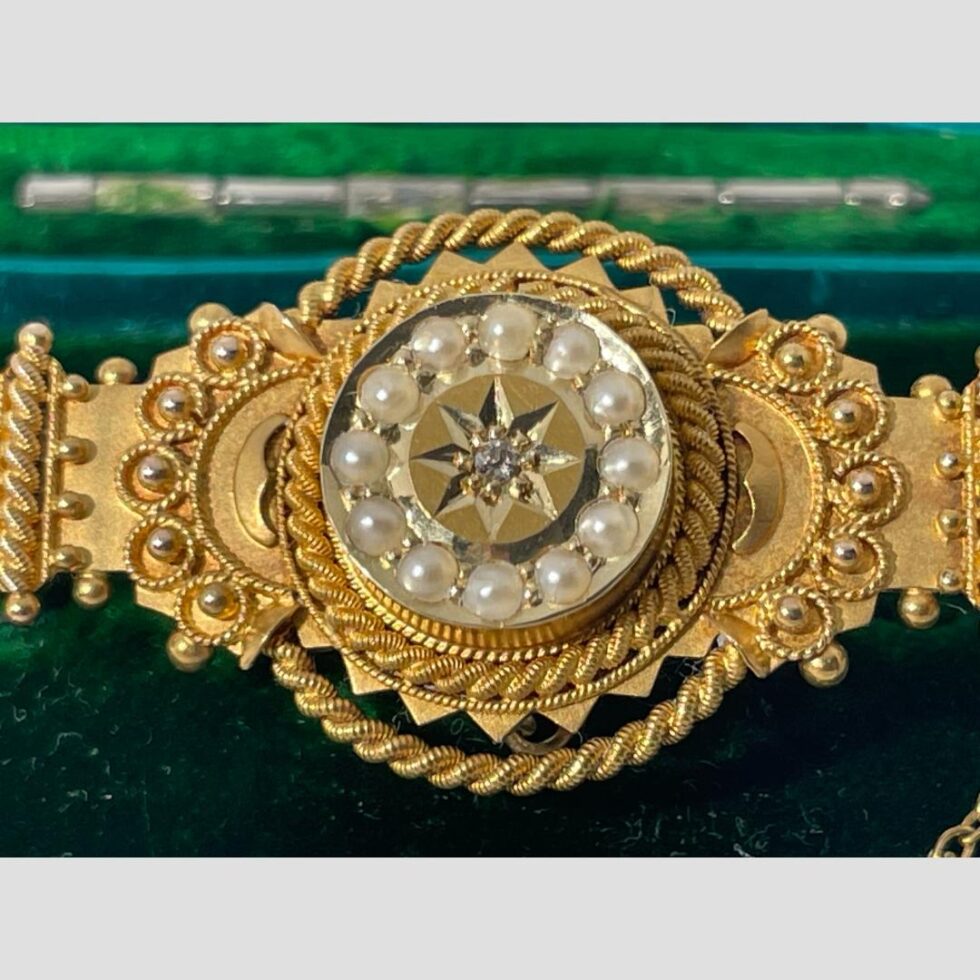 A close up of the central area of the brooch focusing on the central detail.