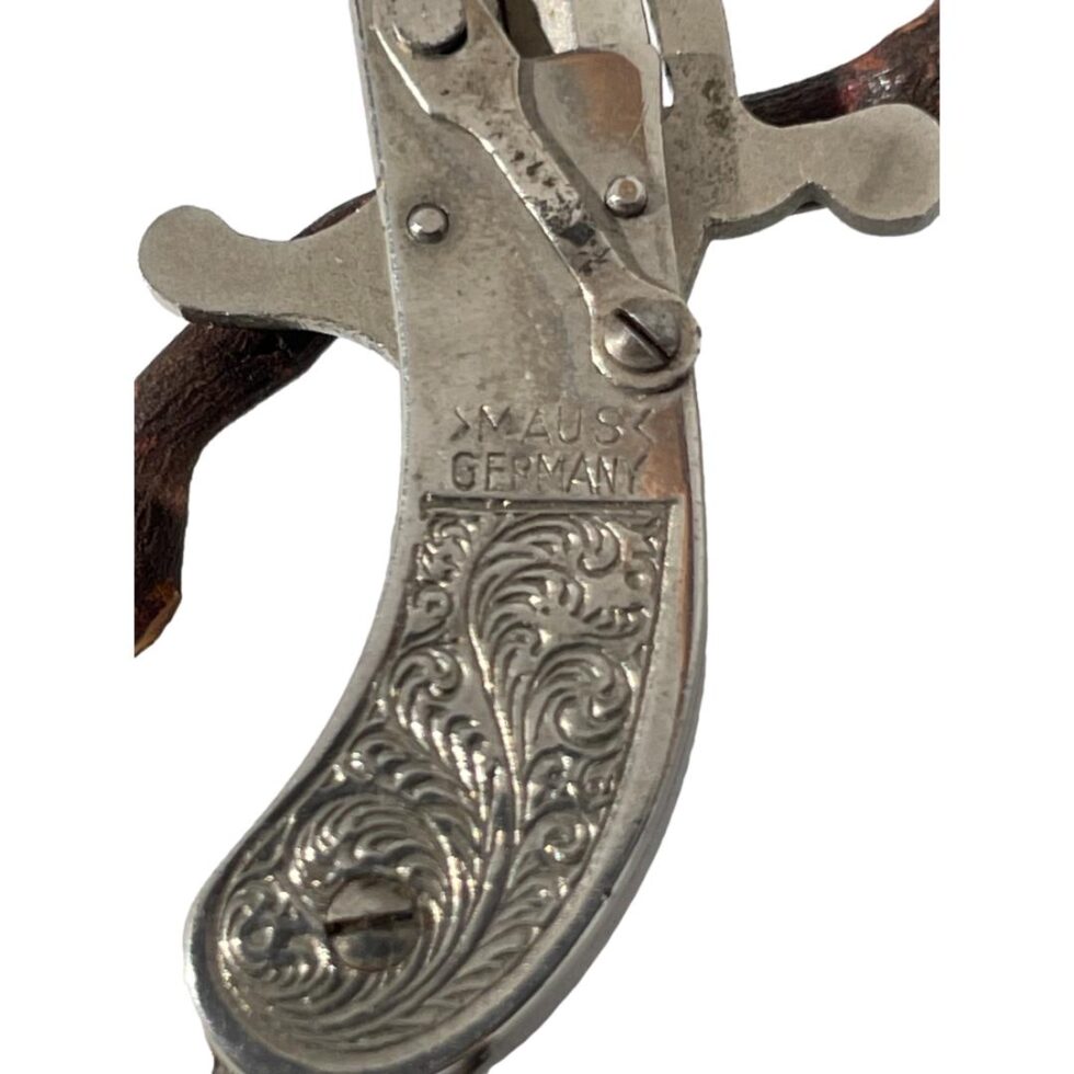 Close up photo of the Maus Germany mark on the handle above the scrollwork.