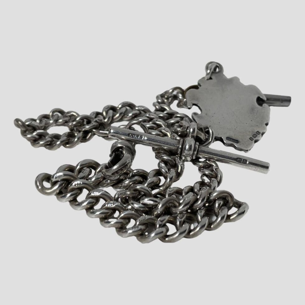 Photo of the whole Albert chain displayed with the hallmarks showing on the chain links, T-bar, fob and dog clip.