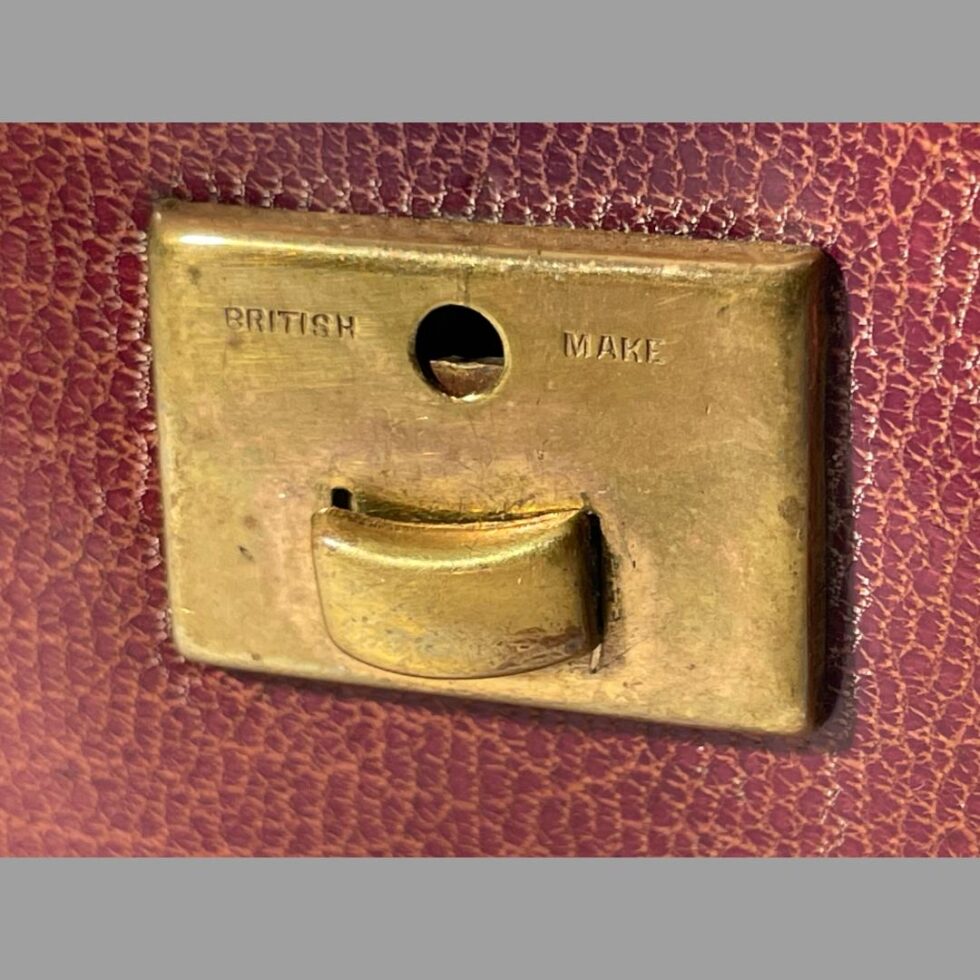 Clo0se up photo of the British Make wording on the brass lock clasp on the front of case.