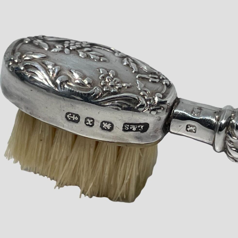 A close up of the brush head showing the full hallmark and the shorter hallmark.
