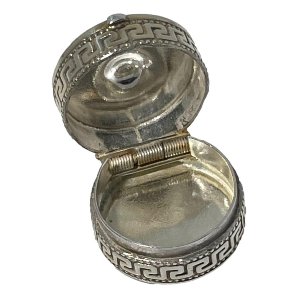 Photo of silver enamel box displayed with the lid open and showing the top and bottom interior of the pot.